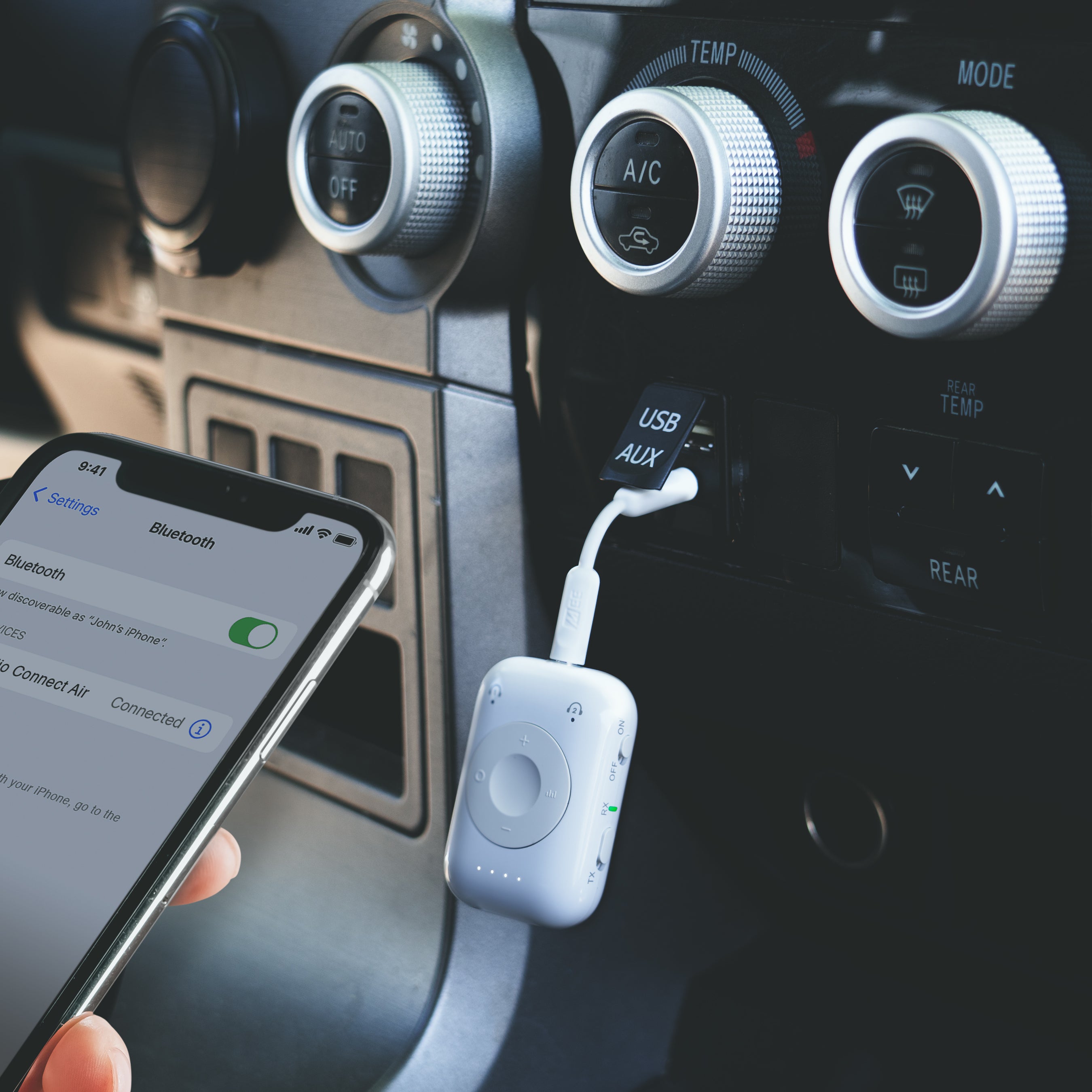 White Connect Air Pro plugged into car with 3.5mm jack and paired via Bluetooth to an iphone in RX mode