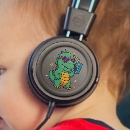 Child wearing Black KJ55AUX headphones with a cartoon dinosaur design on the earcup.