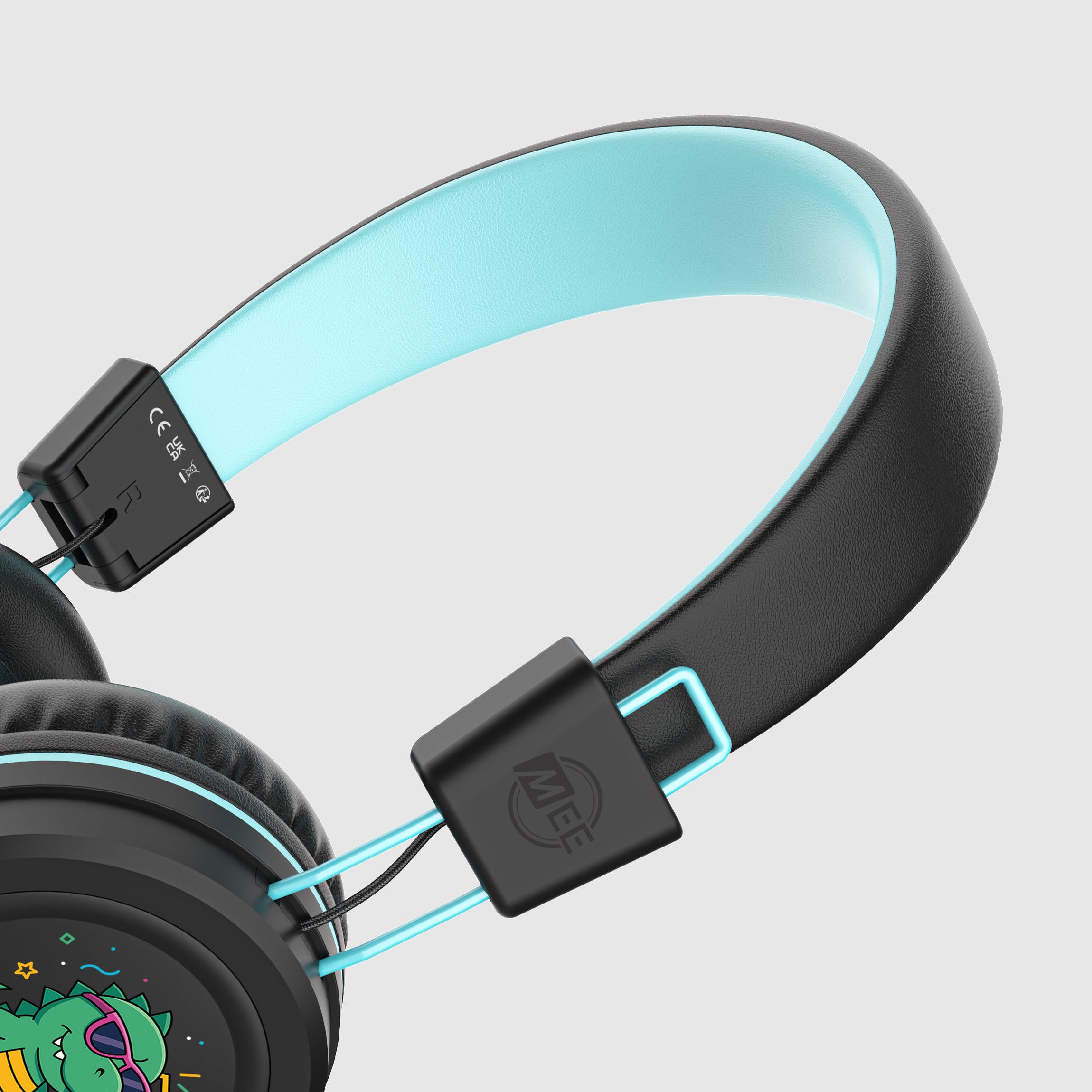 Black KJ55AUX headphones with a cartoon character on a light white background