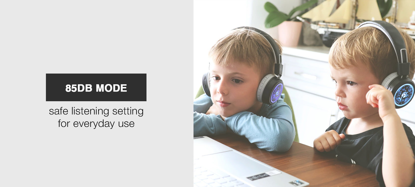 Two children wearing MEE audio KidJamz Share Bluetooth Wireless Headphones for Kids with Multipoint, LED Lights, 85dB Volume Limiter, Microphone, 40h battery; Childrens Headset for School/iPhone/iPad/Tablet