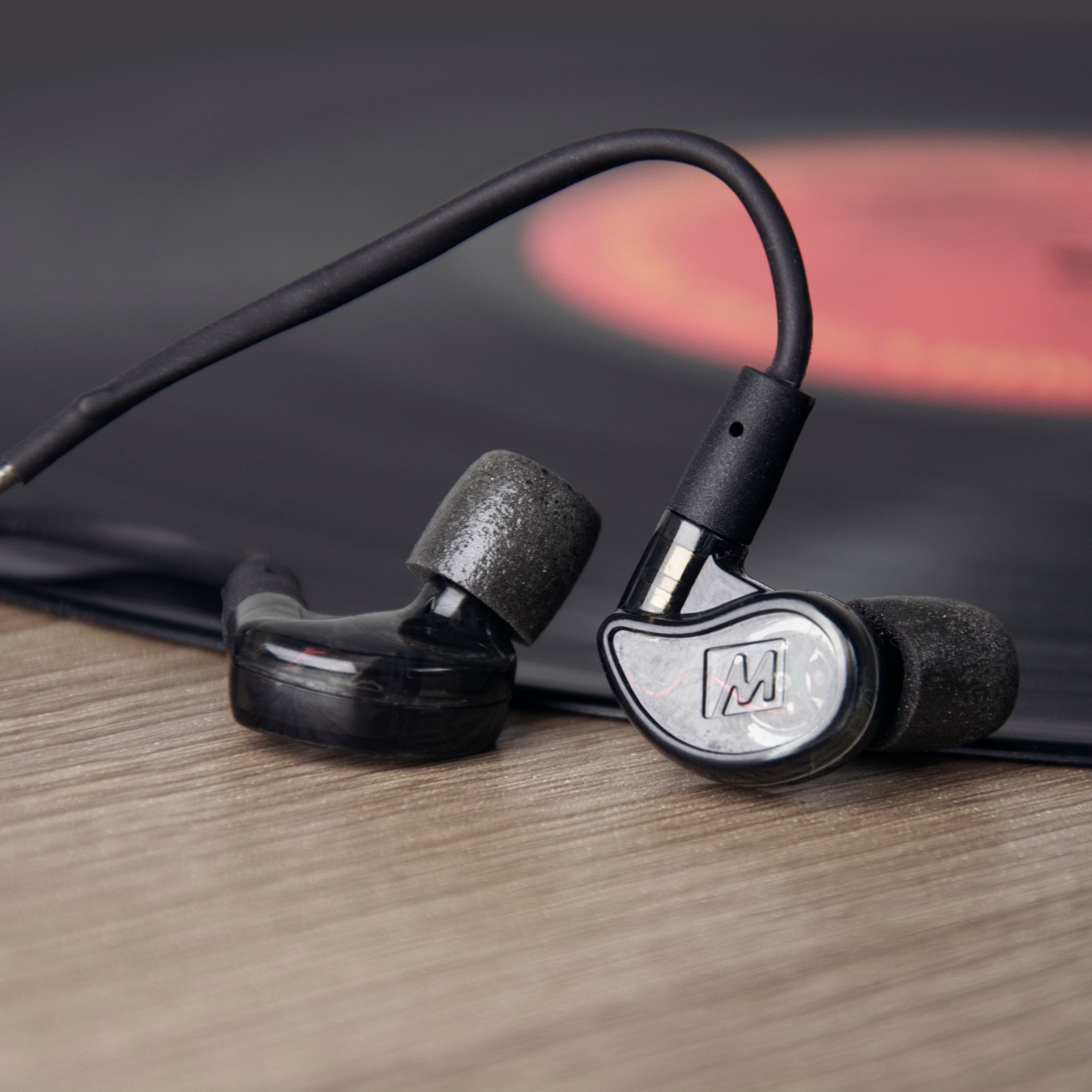 musician wearing the mee audio m6pro in-ear monitors