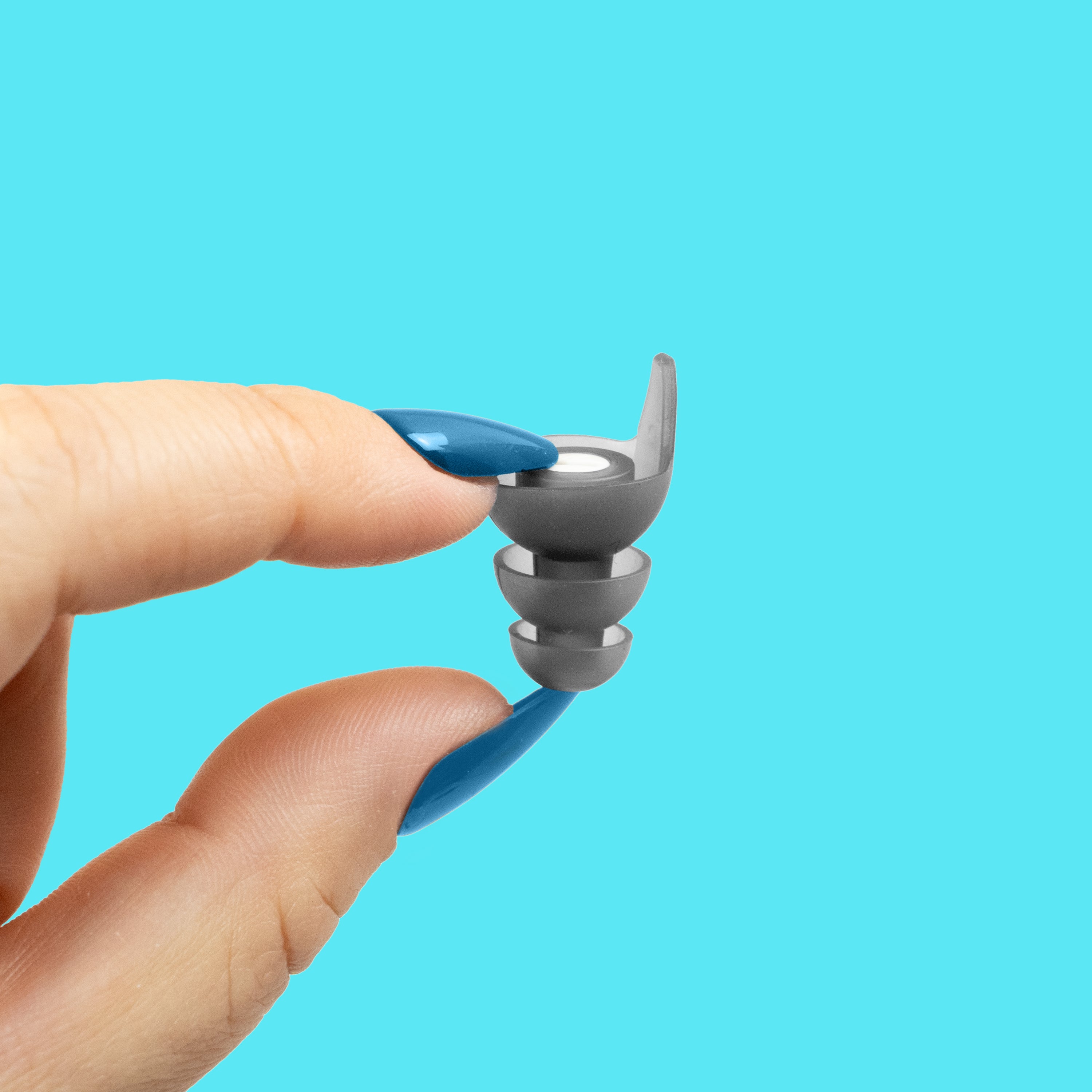 hand holding earplug
