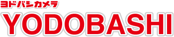 Red and white logo of yodobashi camera, featuring the name "yodobashi" in bold, uppercase, western-style letters along with japanese katakana characters above.