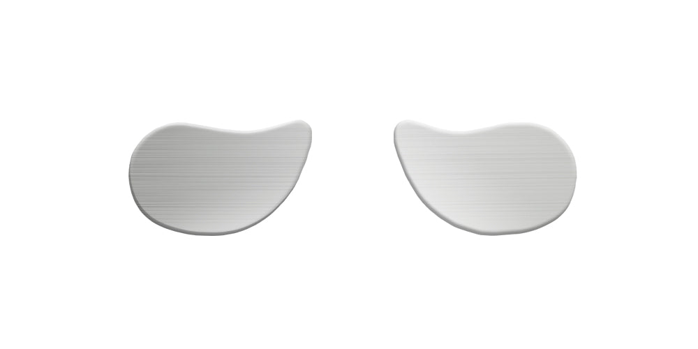 Two ergonomic, white mouse pads with wrist rests displayed against a plain white background.