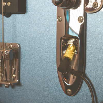 1/4" Adapter plugged into guitar