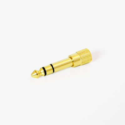 Gold 1/4" Adapter on a white background