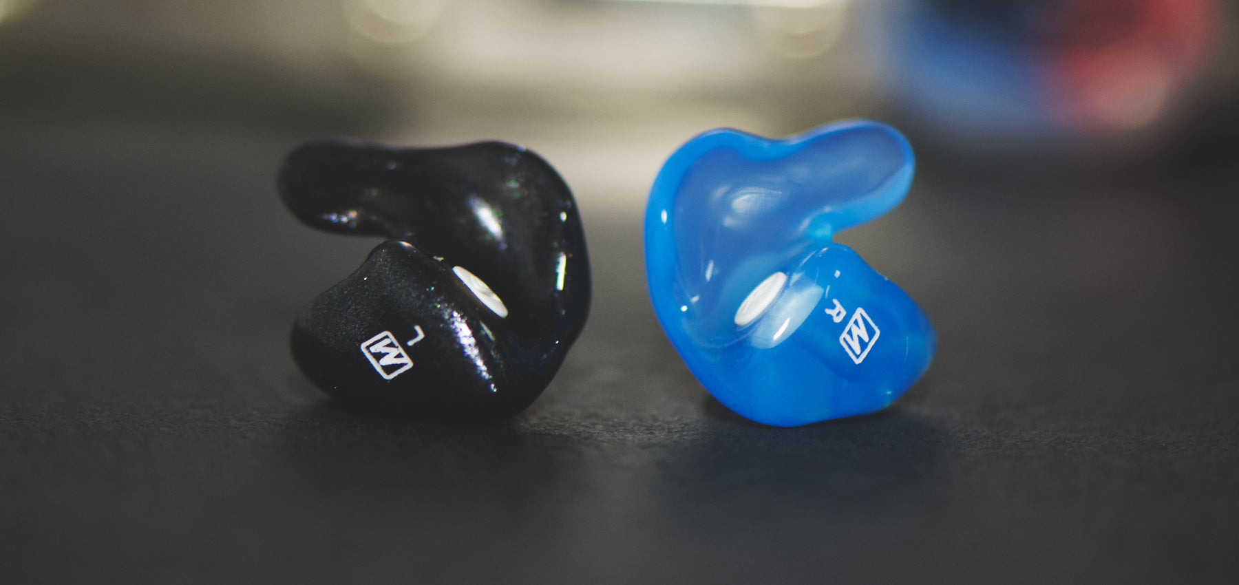 Black and blue earplugs for hearing protection at concerts