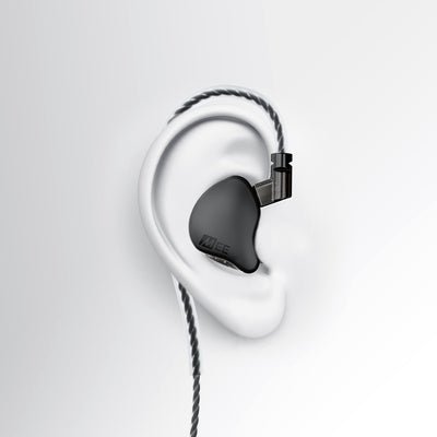 A black MEE audio CORE 2 dual hybrid driver in-ear monitor earpiece with a braided cable and connector, shown mounted on a white stylized ear model against a light gray background.