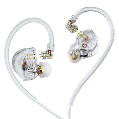 Transparent MEE audio CORE 3 triple hybrid driver in-ear monitors with white cables and gold-tone internal components, shown on a clean white background. The earbuds feature a clear housing with visible internal circuitry and a white silicone ear tip.