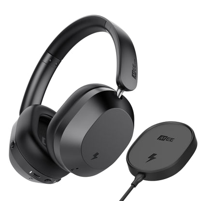 Black headphones with a wireless charging pad on a white background