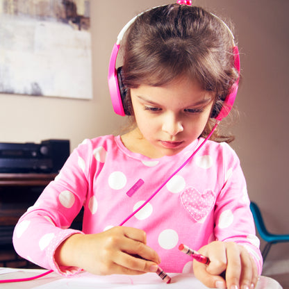 a girl in pink wearing the Kidjamz safe listening headphones for Kids