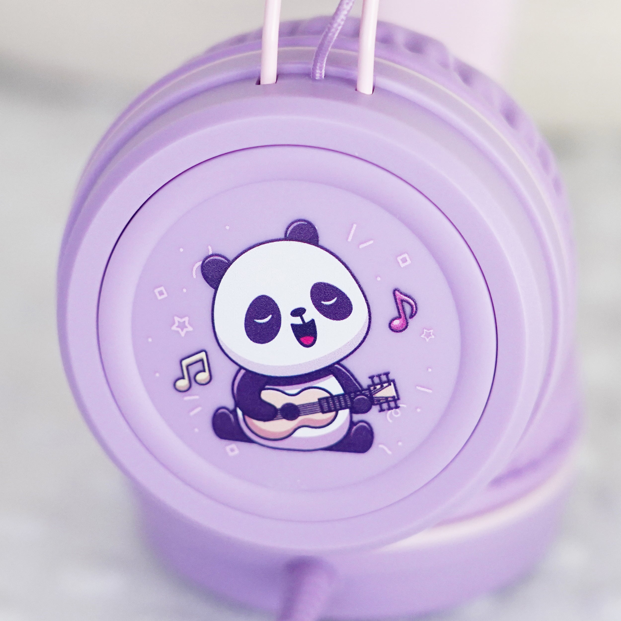 Lavender KidJamz KJ55AUX faceplate with a cartoon panda design holding a guitar in color on a light gray background