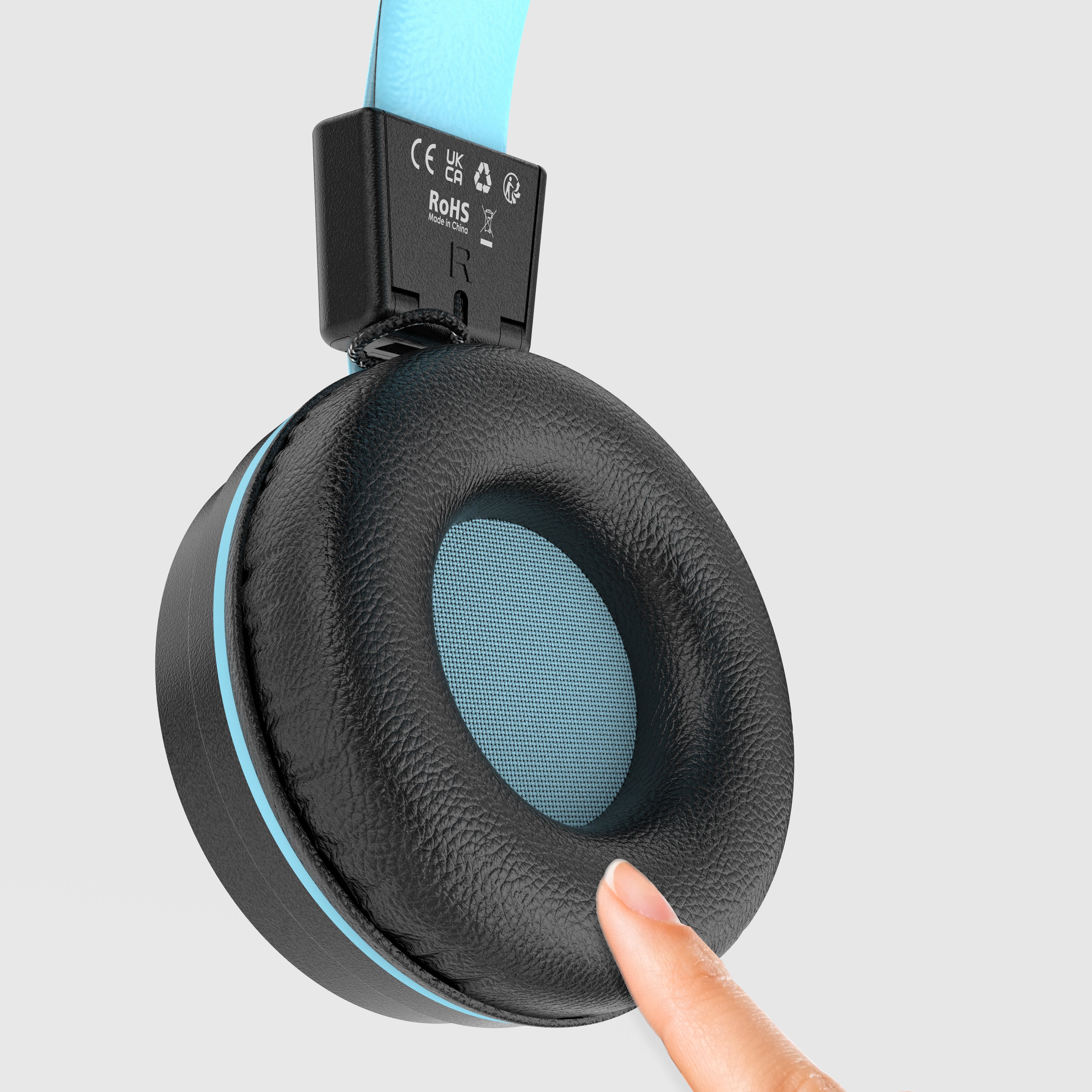 Close-up of a person's finger pressing on the cushioned ear pad of a black and blue headphone, displaying the softness of the ear pad, with icons indicating certifications on the headband.
