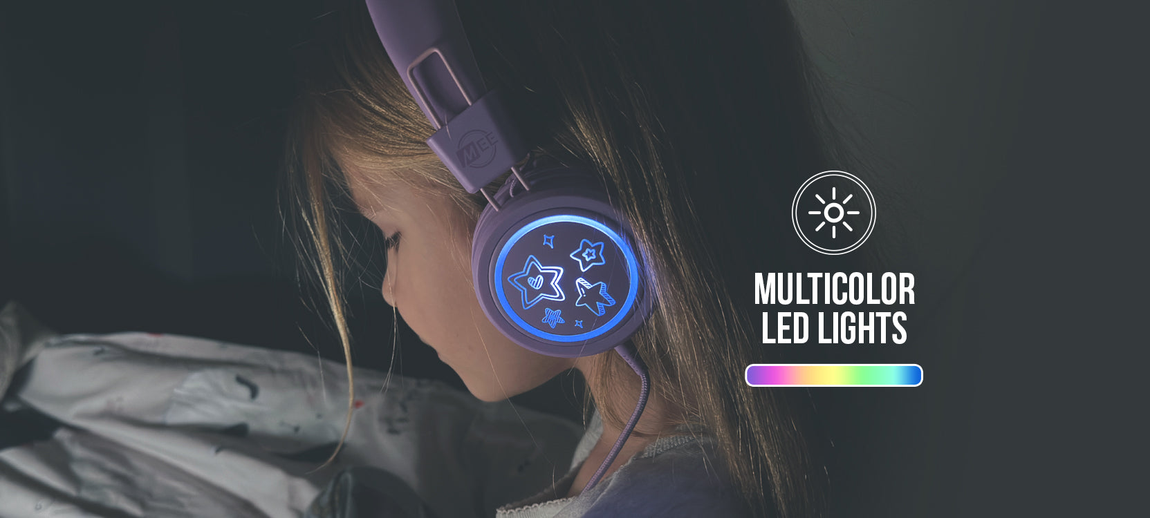 A young girl wearing headphones with glowing multicolor led lights in a dark room, focused on a screen just outside the frame. the text mentions "multicolor led lights.
