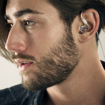 Musician wearing clear M6 PRO in-ear monitors