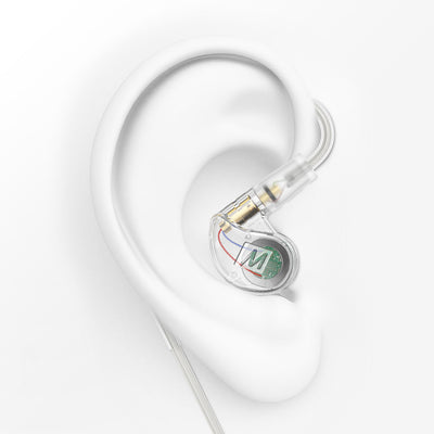 Clear M6 PRO in-ear monitors on a white ear display 
