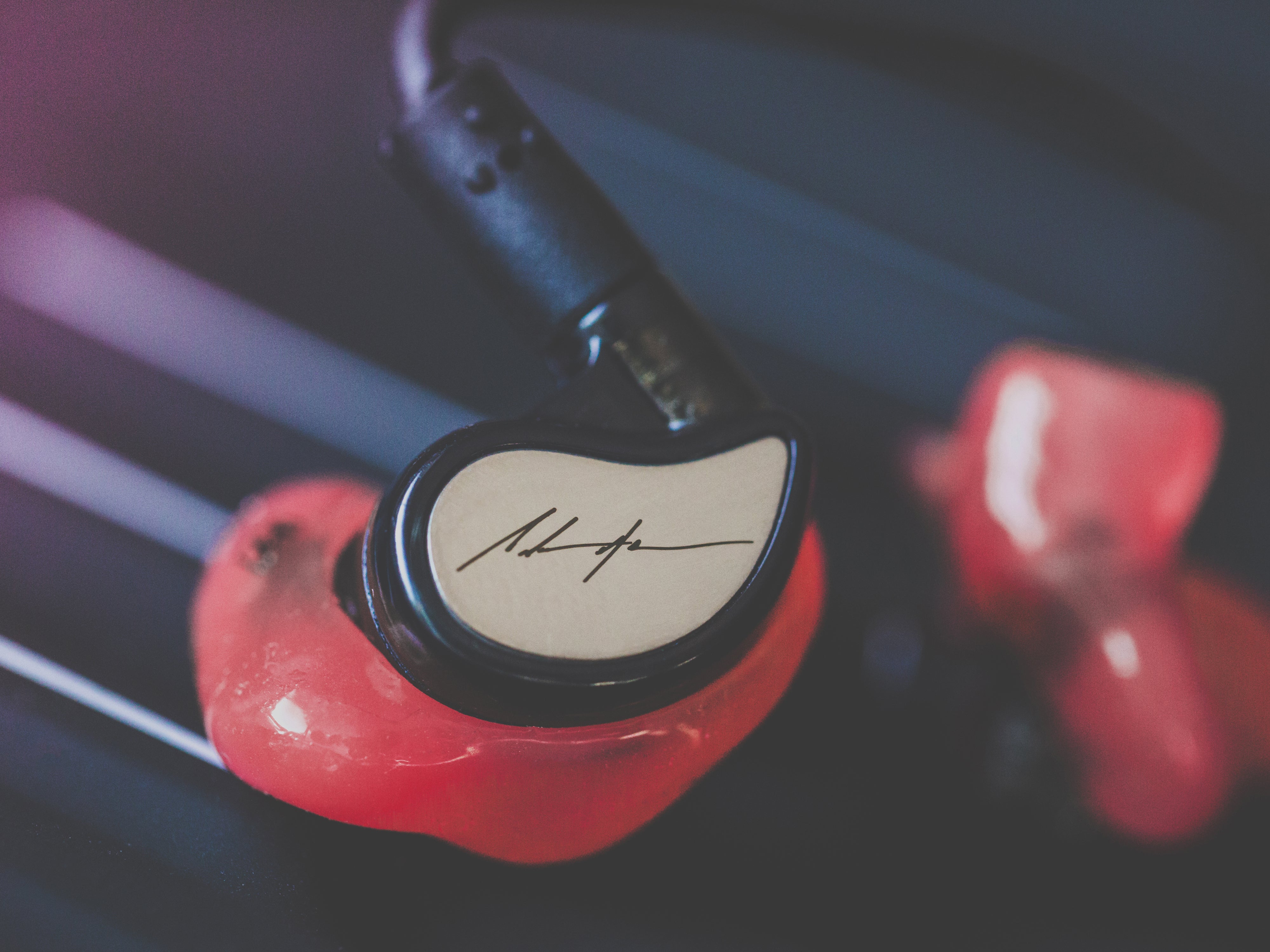 Close-up of M6 PRO Musicians' In-Ear Monitors with custom faceplates and custom eartips