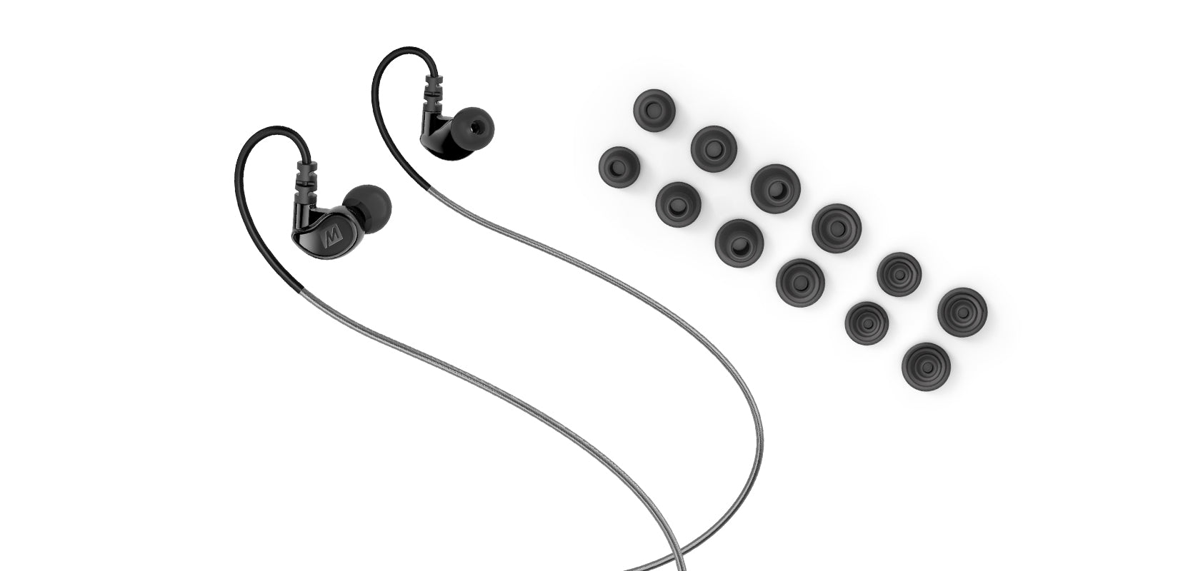 Black in-ear headphones with interchangeable earbuds in various sizes arranged neatly on a white background.