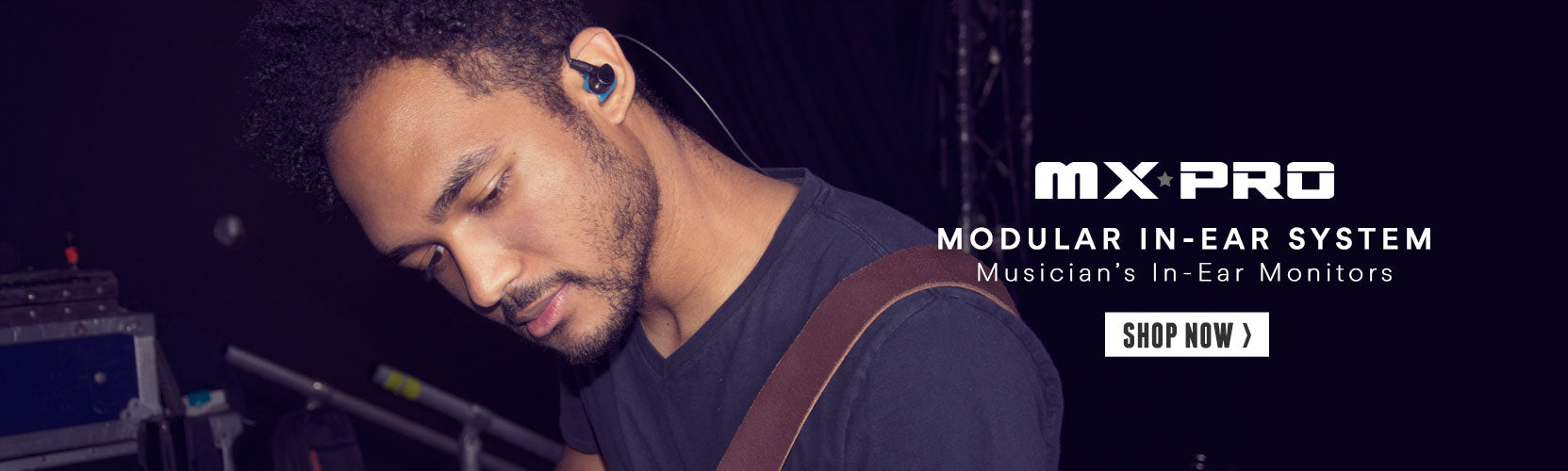 A male musician wearing in-ear monitors focused on adjusting equipment backstage, with promotional text for mxpro modular in-ear system above.