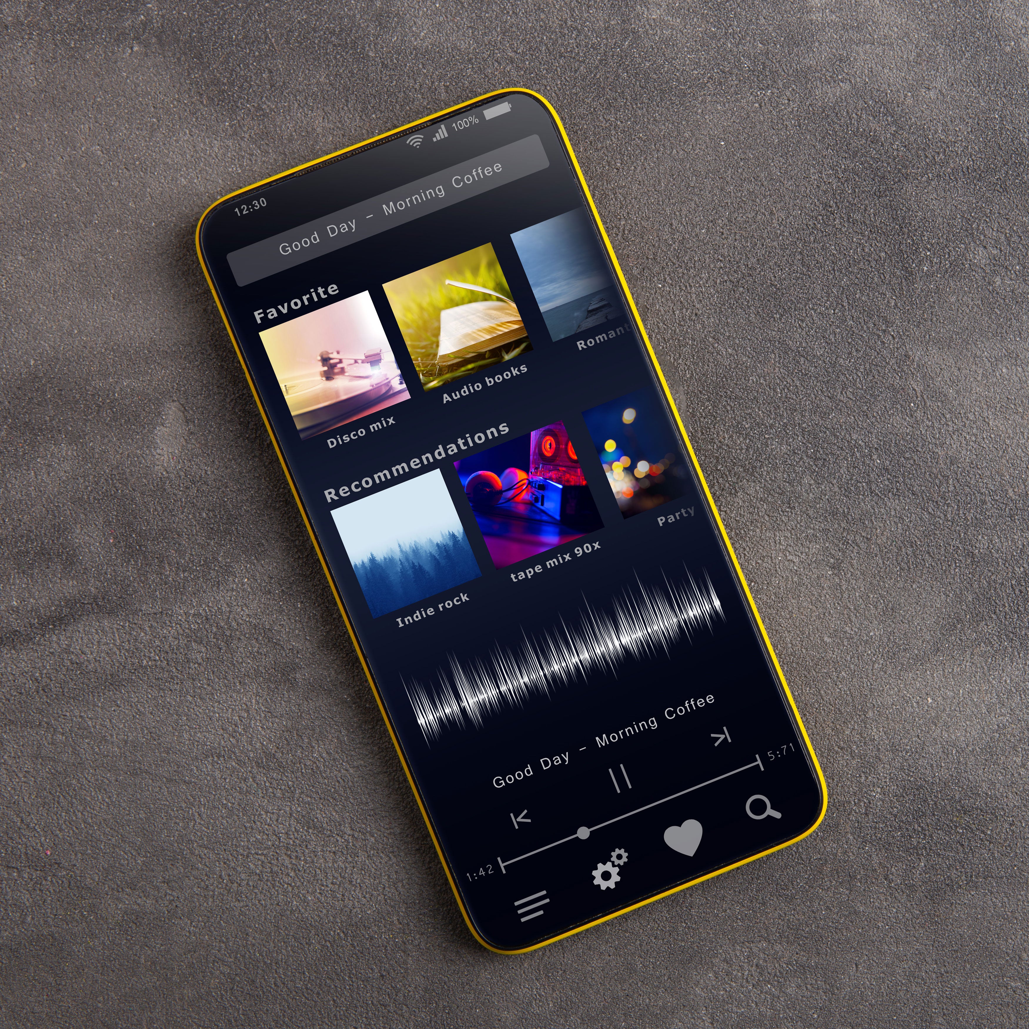 Smartphone displaying a music app interface on a gray surface